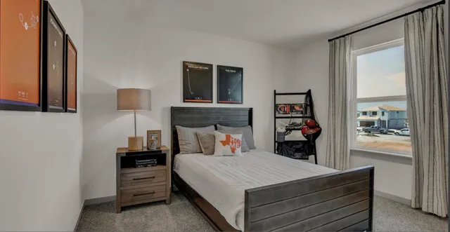 a bed room with a bed and a window