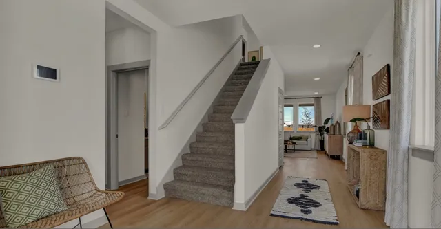 a view of entryway and workspace with wooden floor