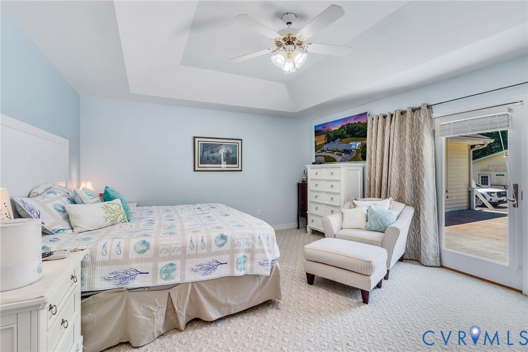 4400 Hacks Neck Road Heathsville, VA 22473 - Photo 19 of 78 a bedroom with a bed a couch and dresser