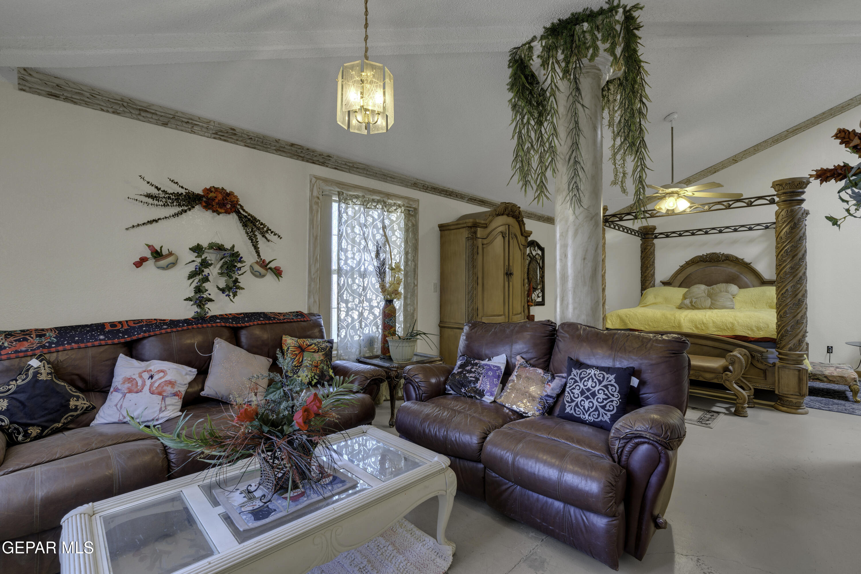 15931 Harrison Road El Paso, TX 79928 - Photo 2 of 83 a living room with furniture and a chandelier