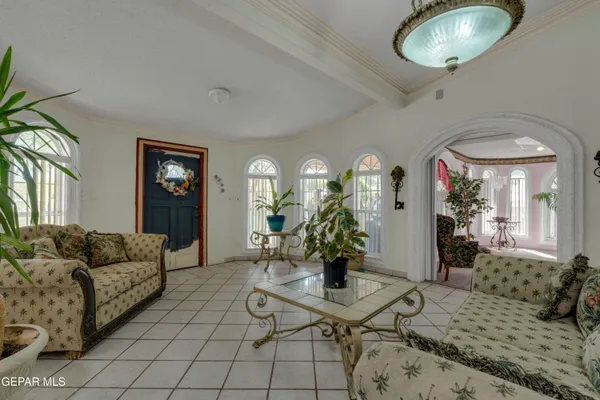 a living room with furniture and a bed