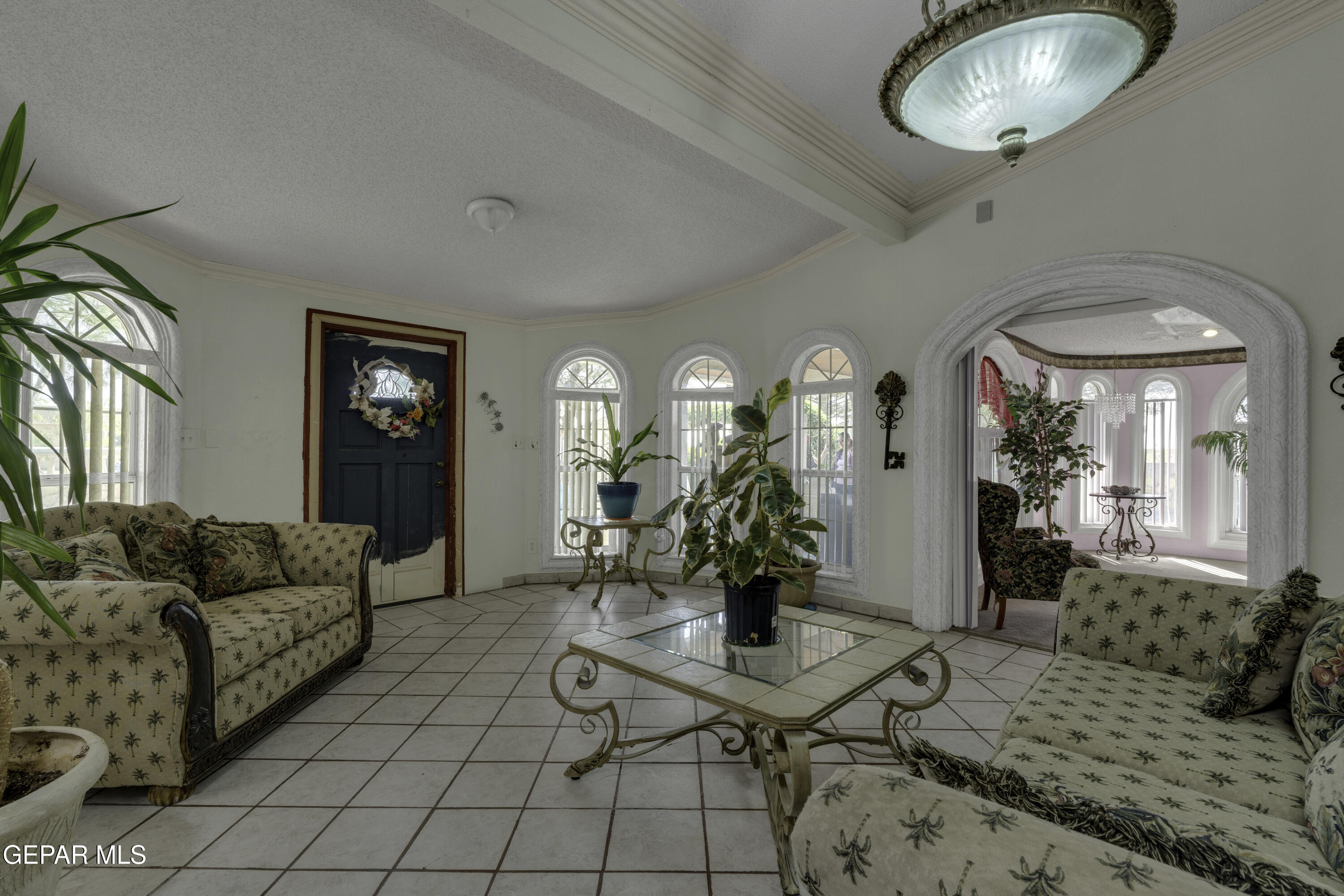 15931 Harrison Road El Paso, TX 79928 - Photo 23 of 83 a living room with furniture and a chandelier