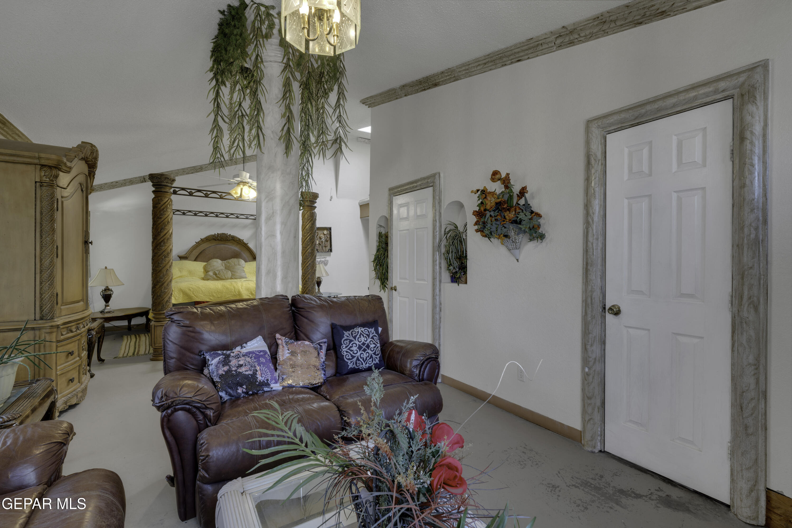 15931 Harrison Road El Paso, TX 79928 - Photo 34 of 83 a living room with furniture and a chandelier