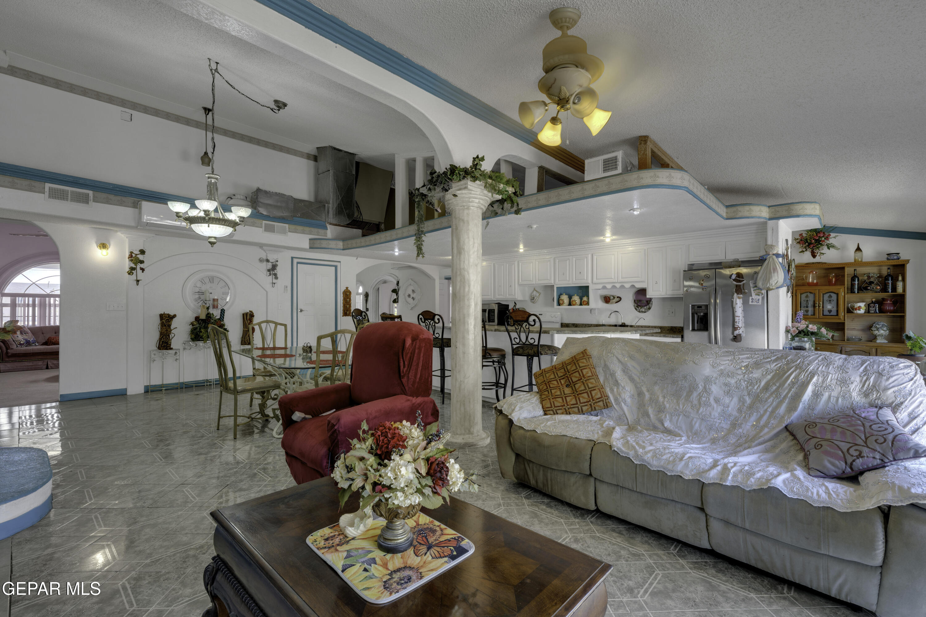 15931 Harrison Road El Paso, TX 79928 - Photo 40 of 83 a living room with furniture and a chandelier