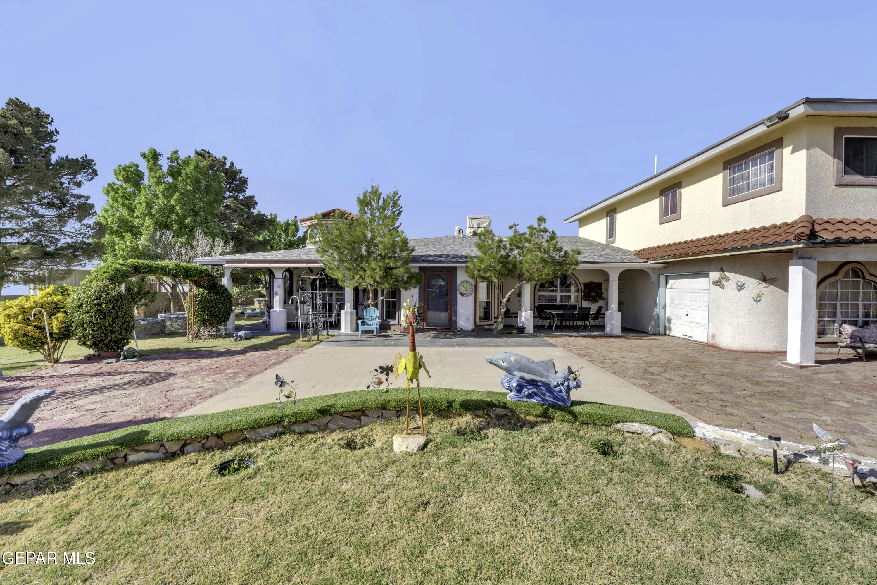 15931 Harrison Road El Paso, TX 79928 - Photo 41 of 83 a view of a house with a yard and sitting area