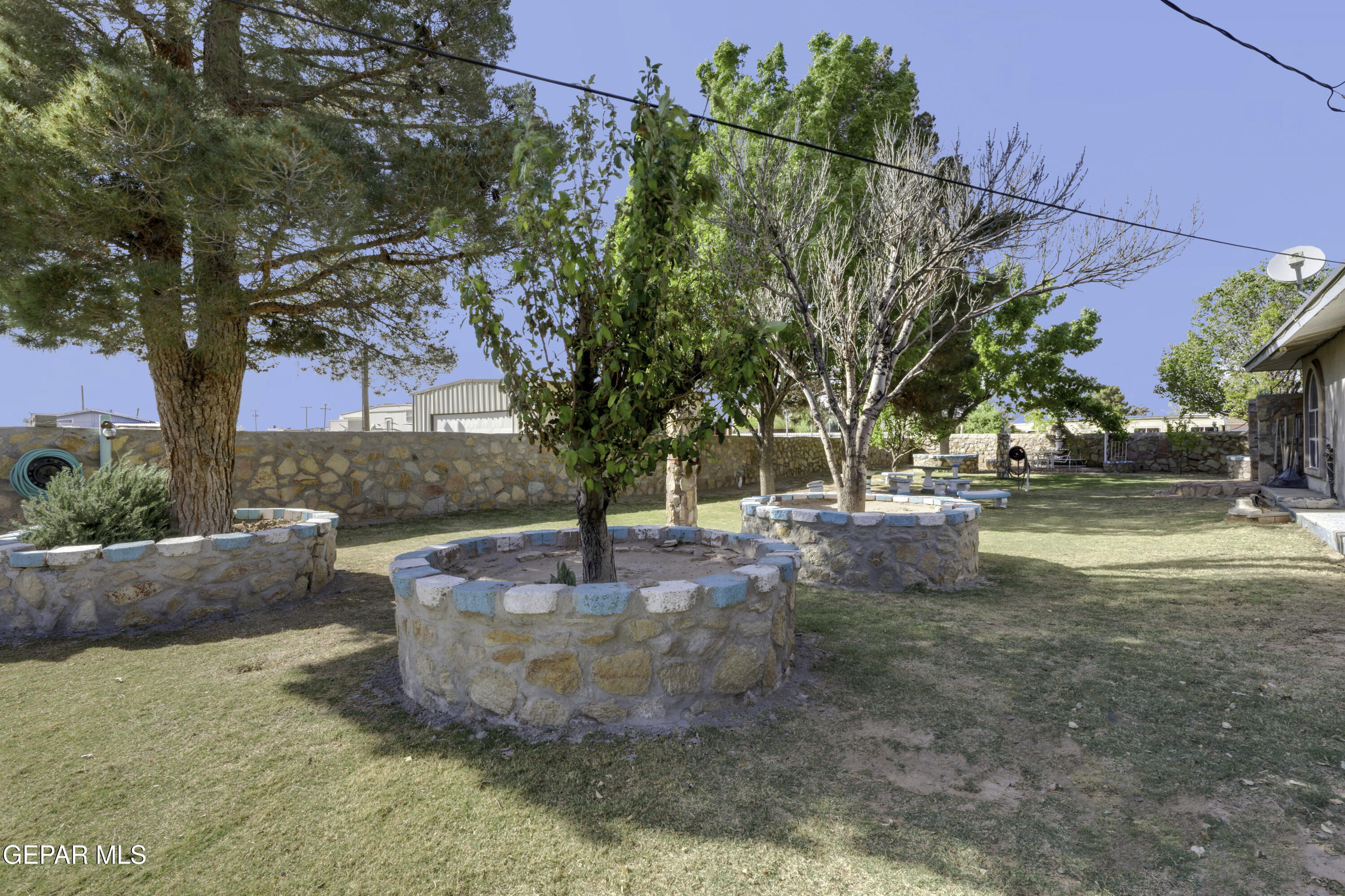 15931 Harrison Road El Paso, TX 79928 - Photo 47 of 83 a view of a yard with a fountain