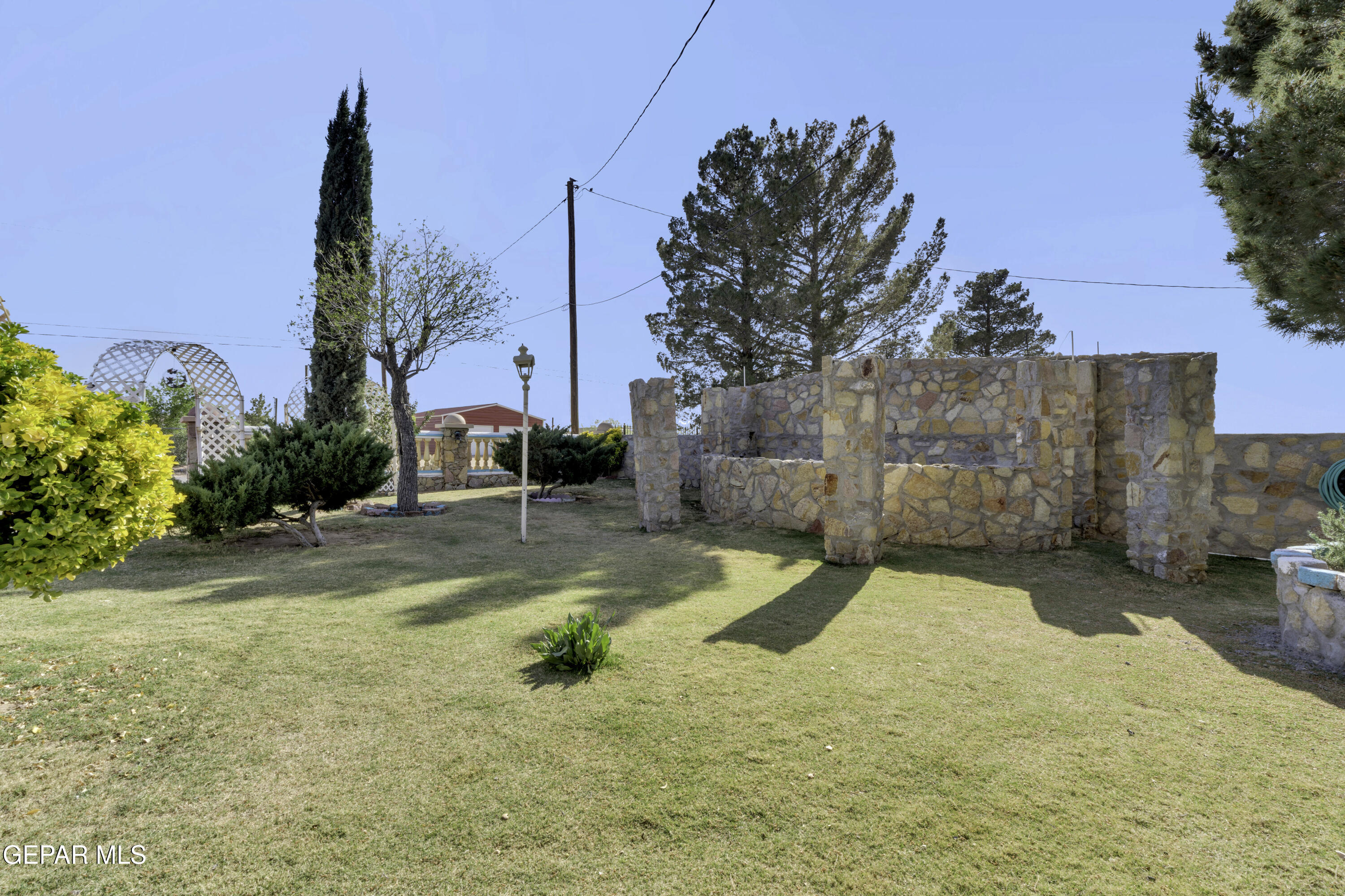 15931 Harrison Road El Paso, TX 79928 - Photo 48 of 83 a view of a swimming pool with a patio
