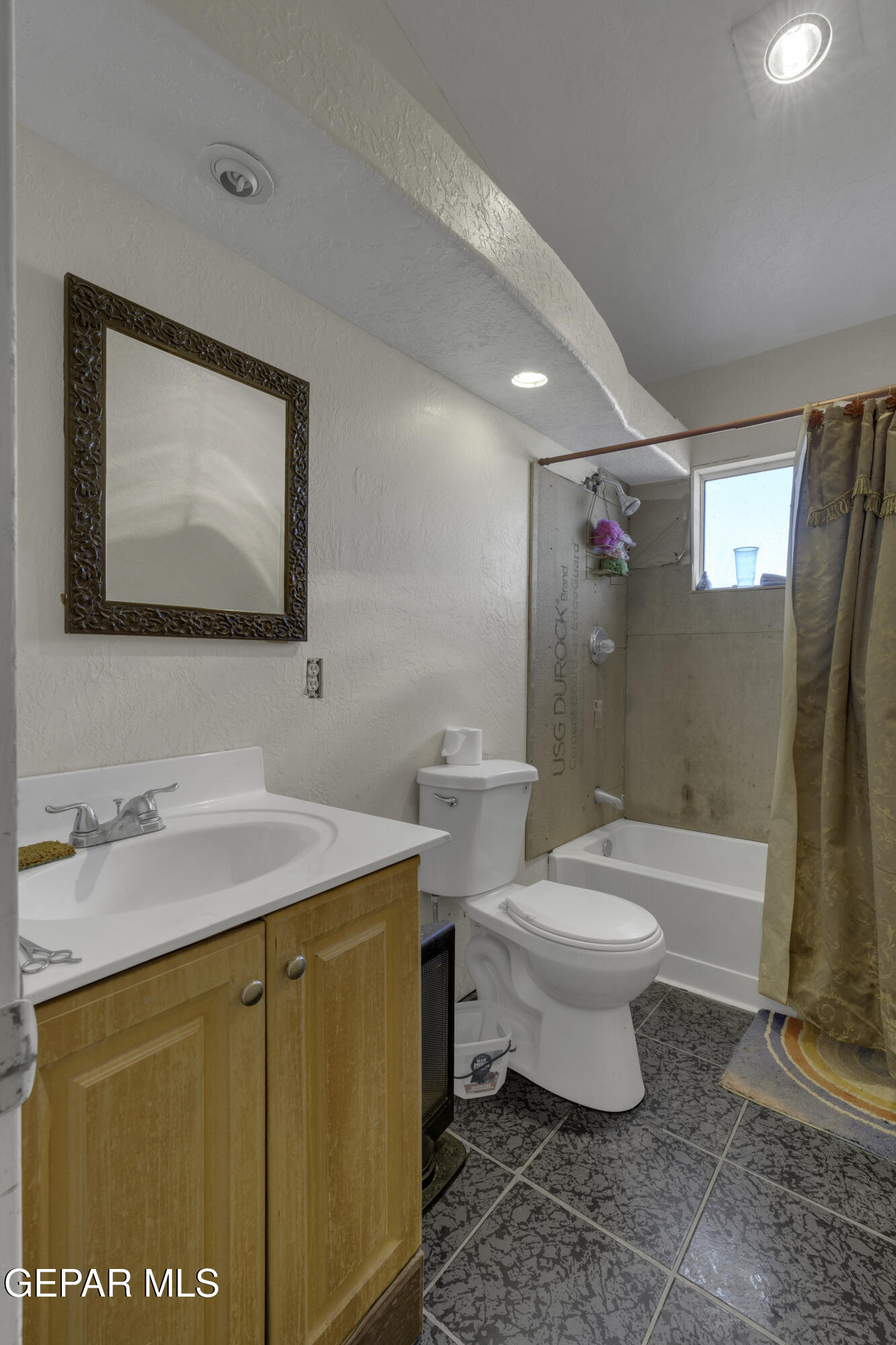 15931 Harrison Road El Paso, TX 79928 - Photo 50 of 83 a bathroom with a sink toilet and shower