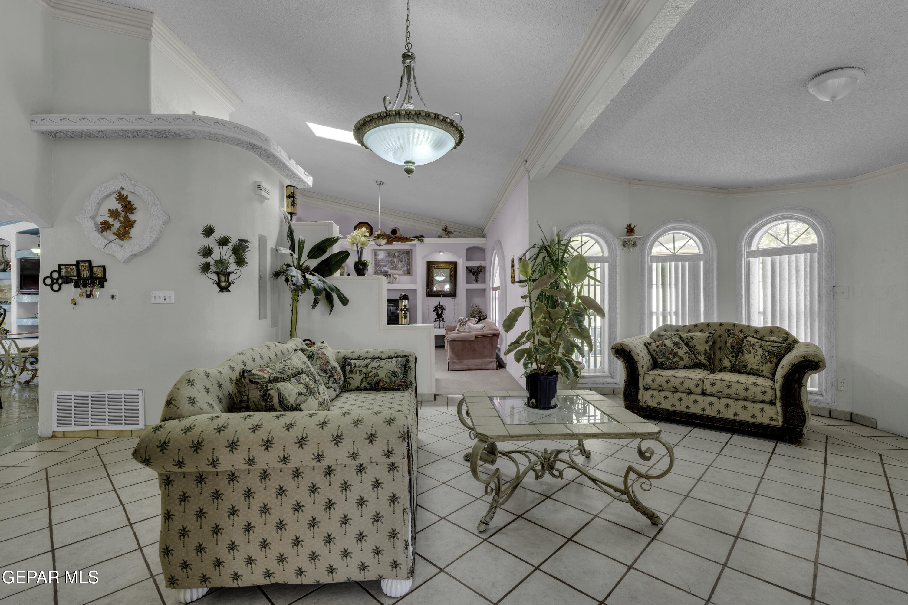 15931 Harrison Road El Paso, TX 79928 - Photo 5 of 83 a living room with furniture and a chandelier