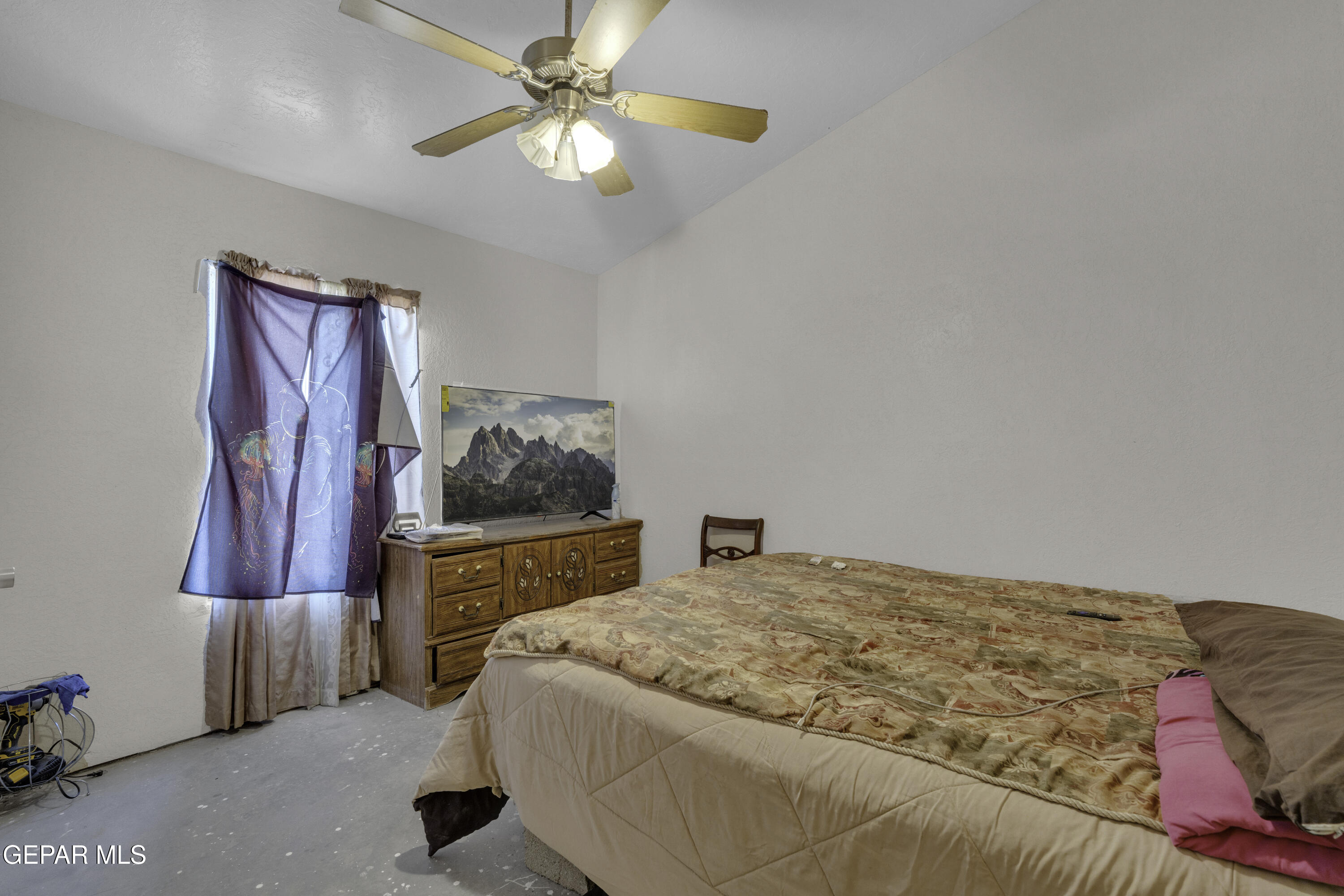 15931 Harrison Road El Paso, TX 79928 - Photo 53 of 83 a bedroom with a bed and a chandelier