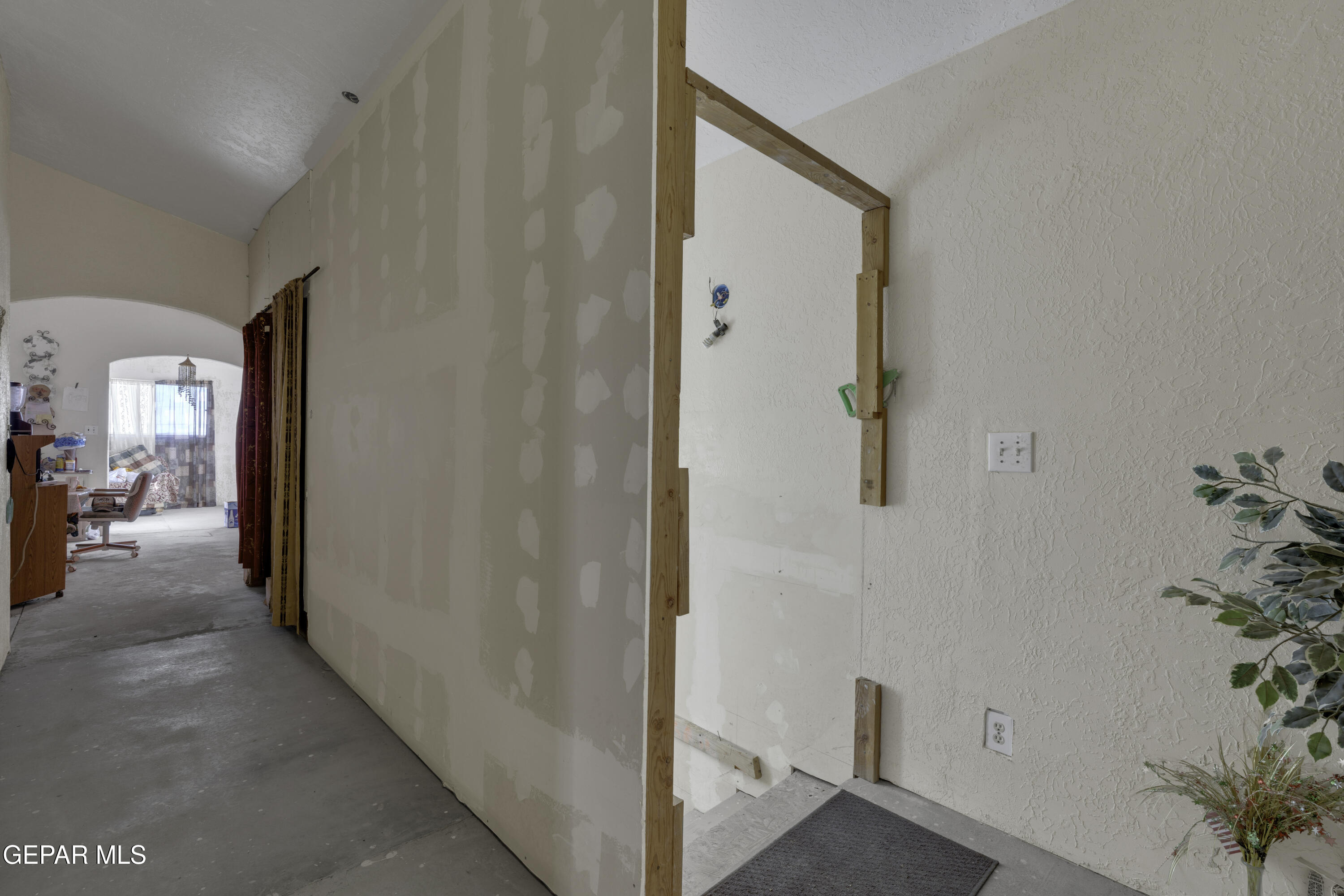 15931 Harrison Road El Paso, TX 79928 - Photo 54 of 83 a view of a hallway with paintings on the wall
