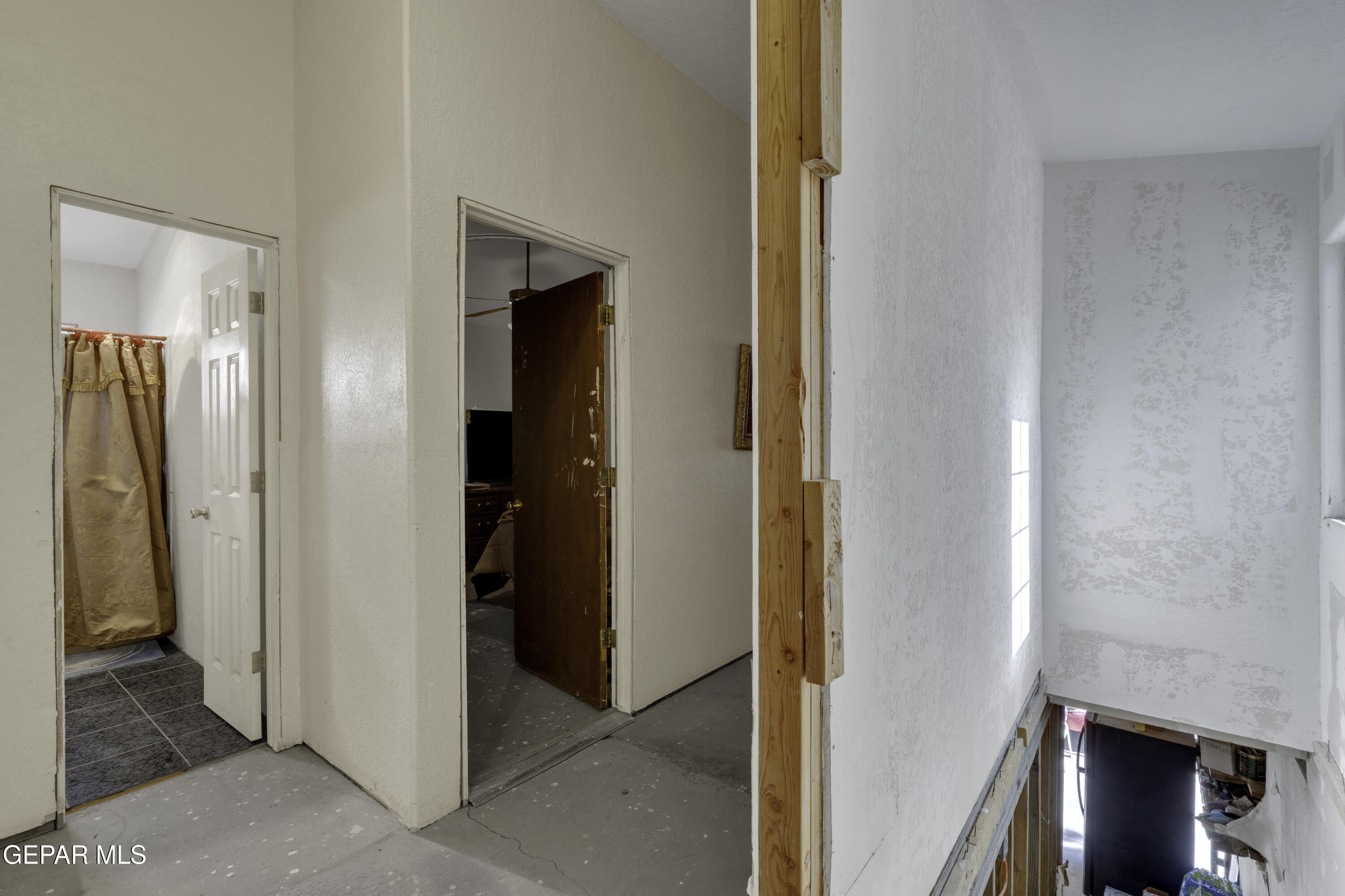 15931 Harrison Road El Paso, TX 79928 - Photo 55 of 83 a view of a hallway with closet and a bathroom