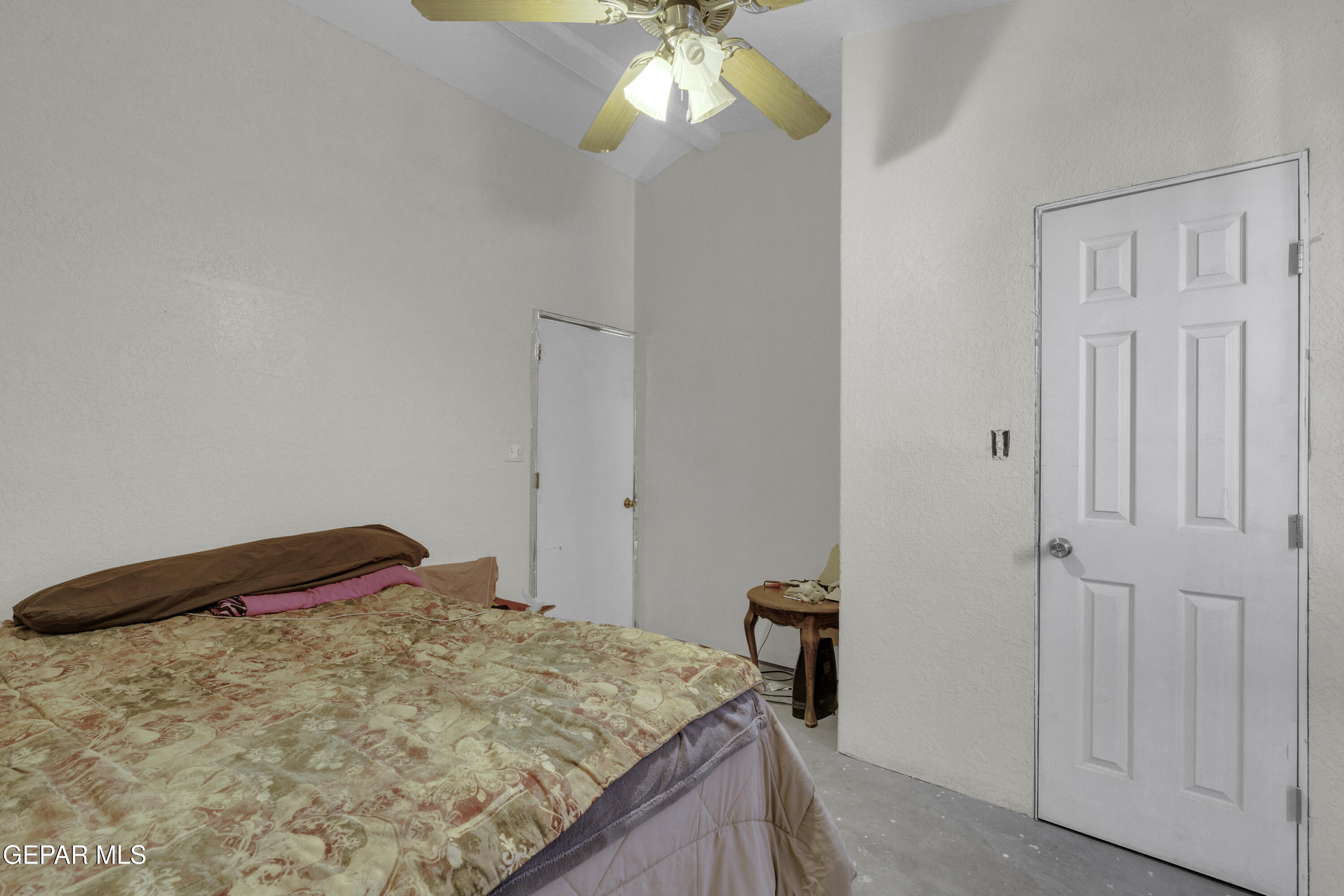 15931 Harrison Road El Paso, TX 79928 - Photo 60 of 83 a bedroom with a bed and a chandelier