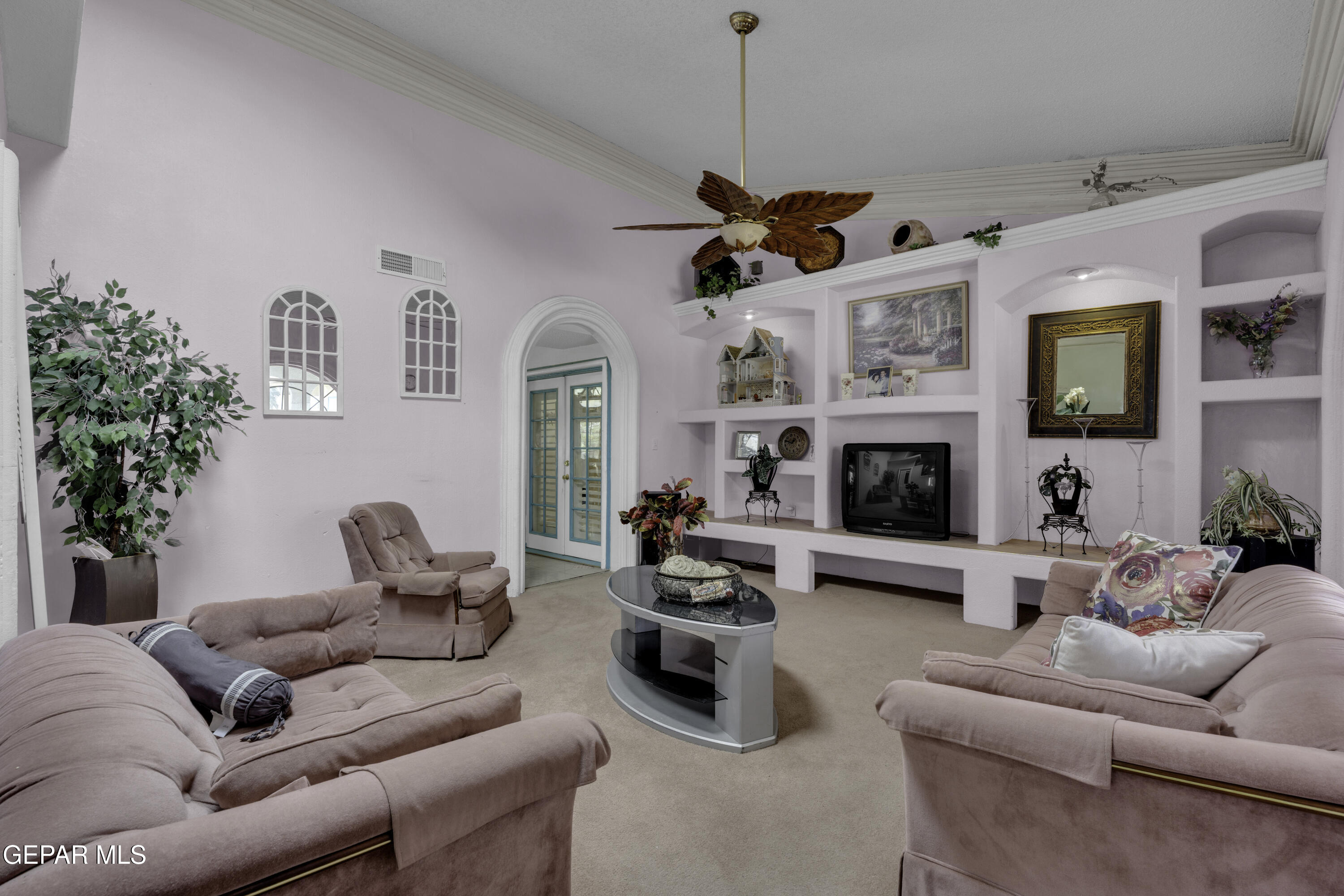 15931 Harrison Road El Paso, TX 79928 - Photo 6 of 83 a living room with furniture a fireplace and a flat screen tv