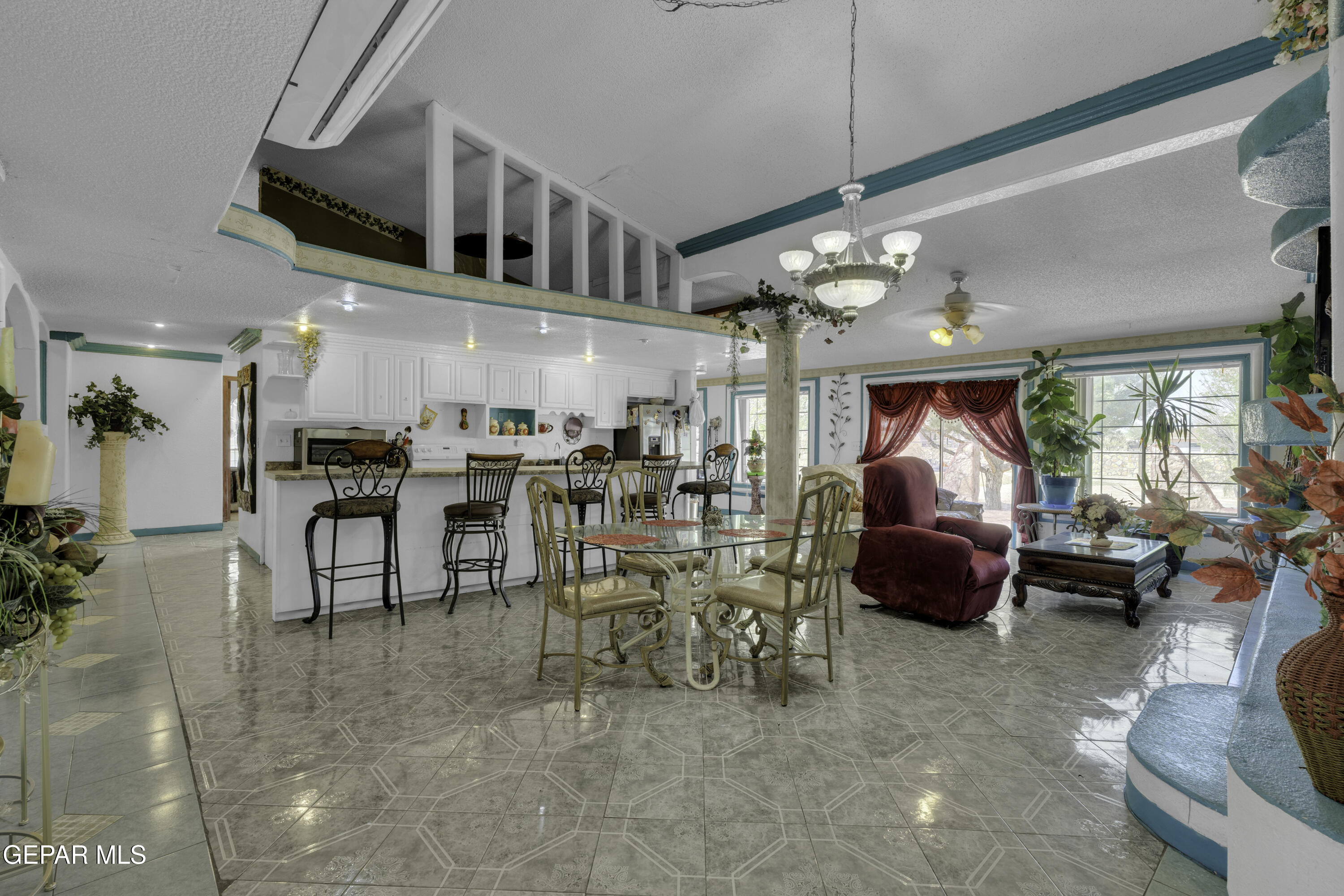 15931 Harrison Road El Paso, TX 79928 - Photo 7 of 83 a group of people sitting in a living room