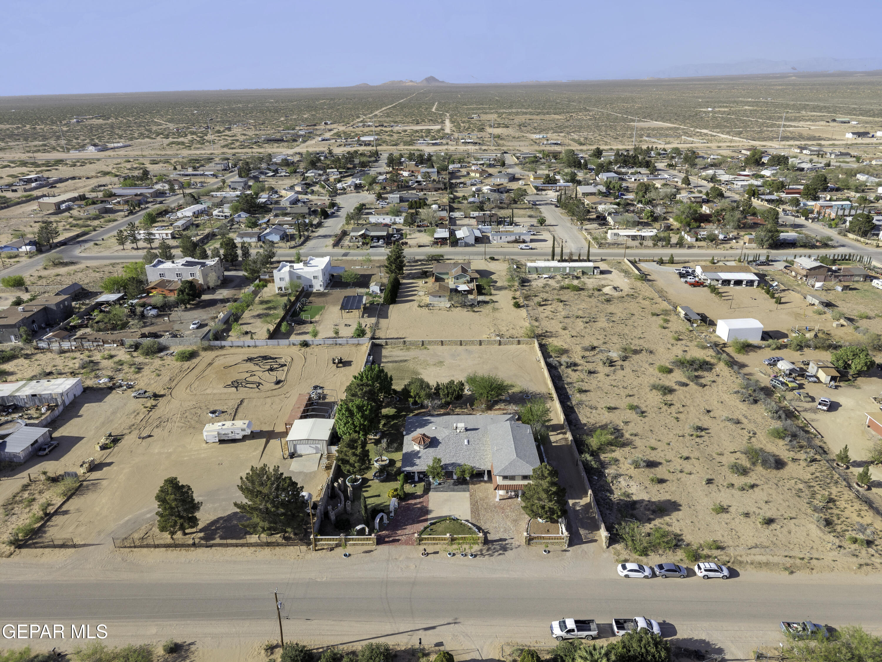 15931 Harrison Road El Paso, TX 79928 - Photo 77 of 83 an aerial view of residential houses with outdoor space