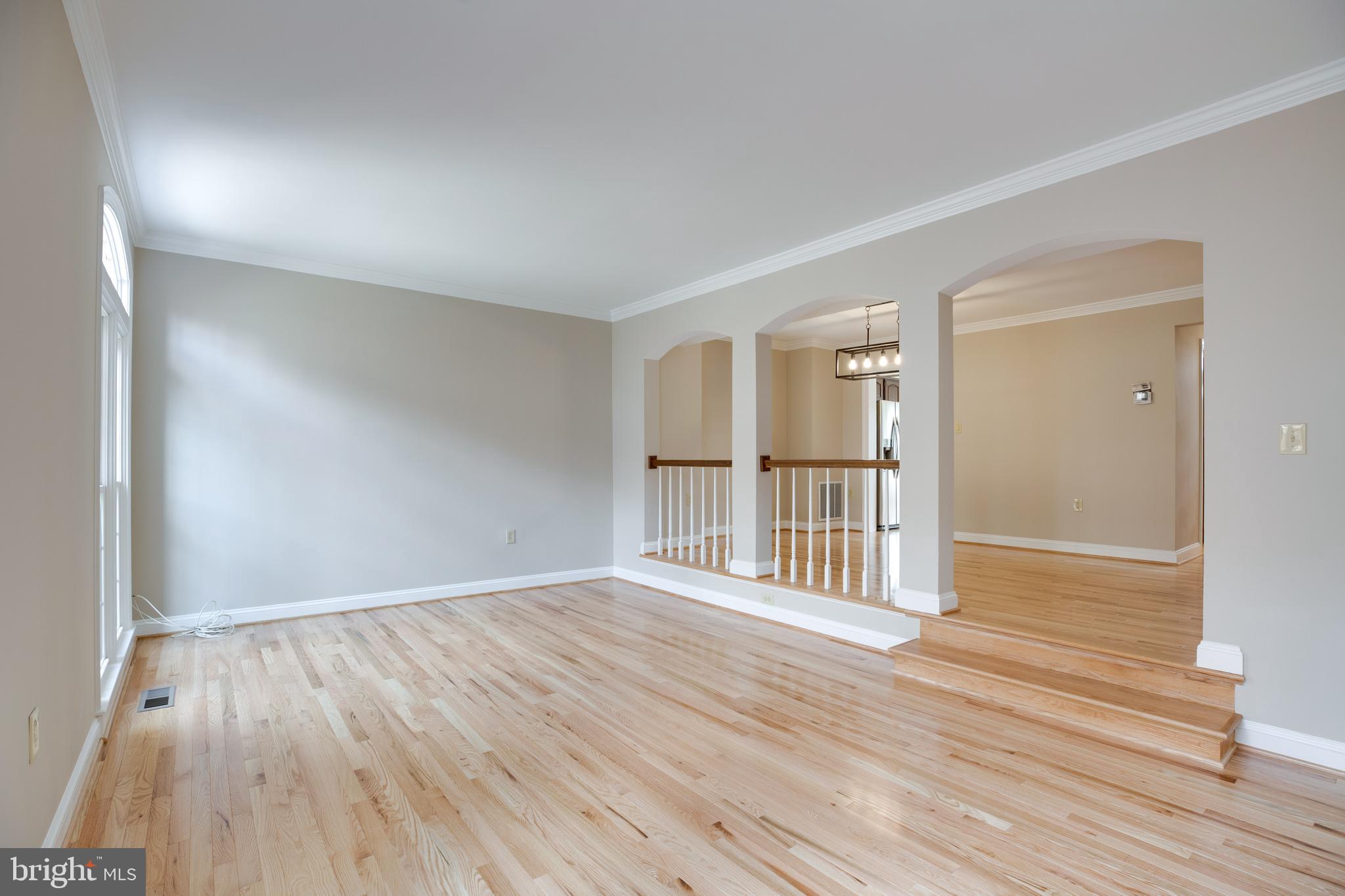 6502 Westhaven Lane Springfield, VA 22150 - Photo 12 of 31 a view of an empty room with wooden floor and a window