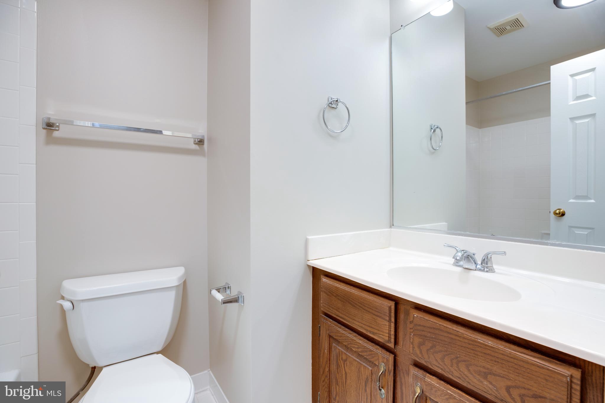 6502 Westhaven Lane Springfield, VA 22150 - Photo 17 of 31 a bathroom with a sink toilet and vanity