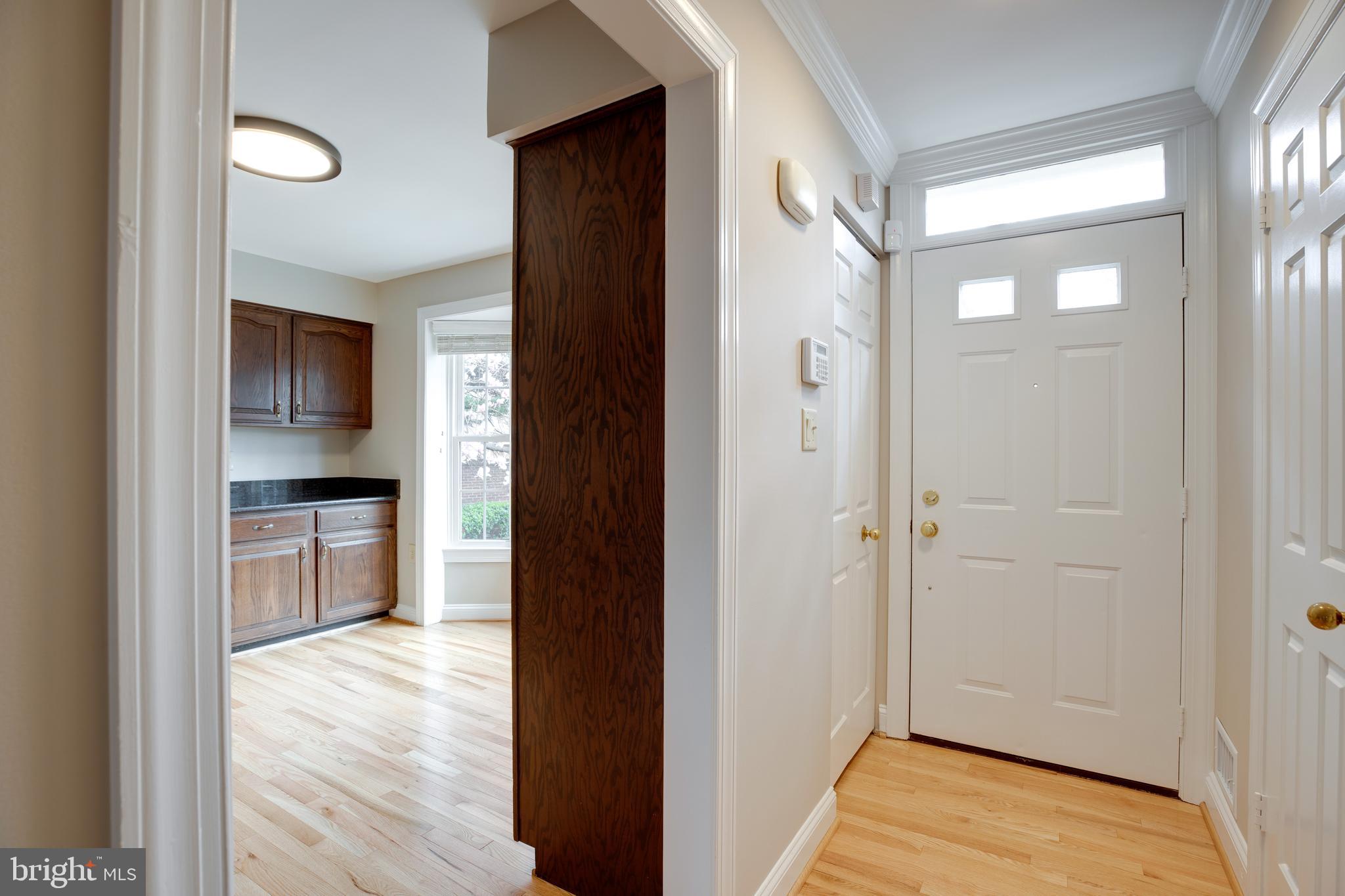 6502 Westhaven Lane Springfield, VA 22150 - Photo 2 of 31 a view of a hallway with wooden floor and a living room