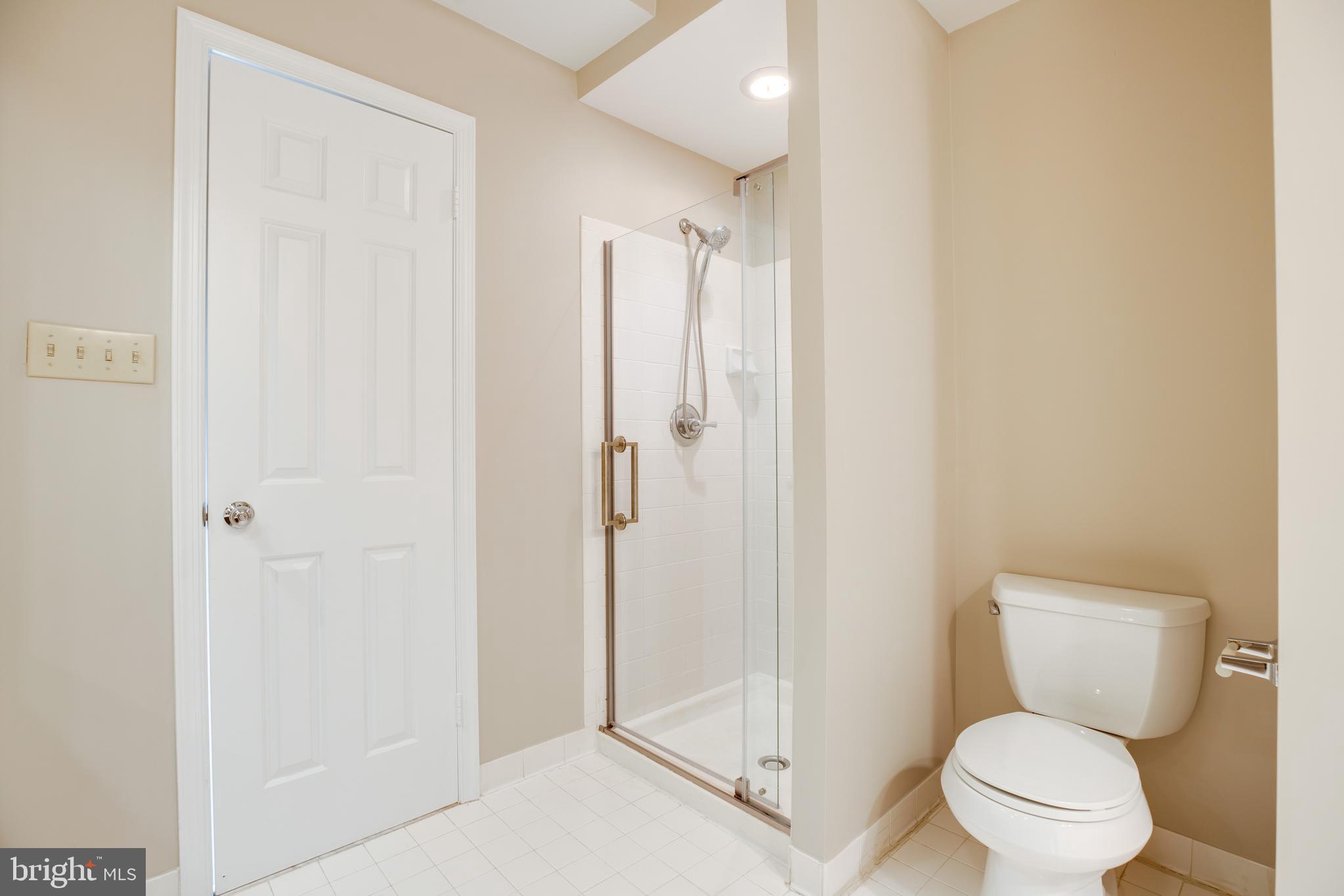 6502 Westhaven Lane Springfield, VA 22150 - Photo 23 of 31 a bathroom with a toilet and a shower