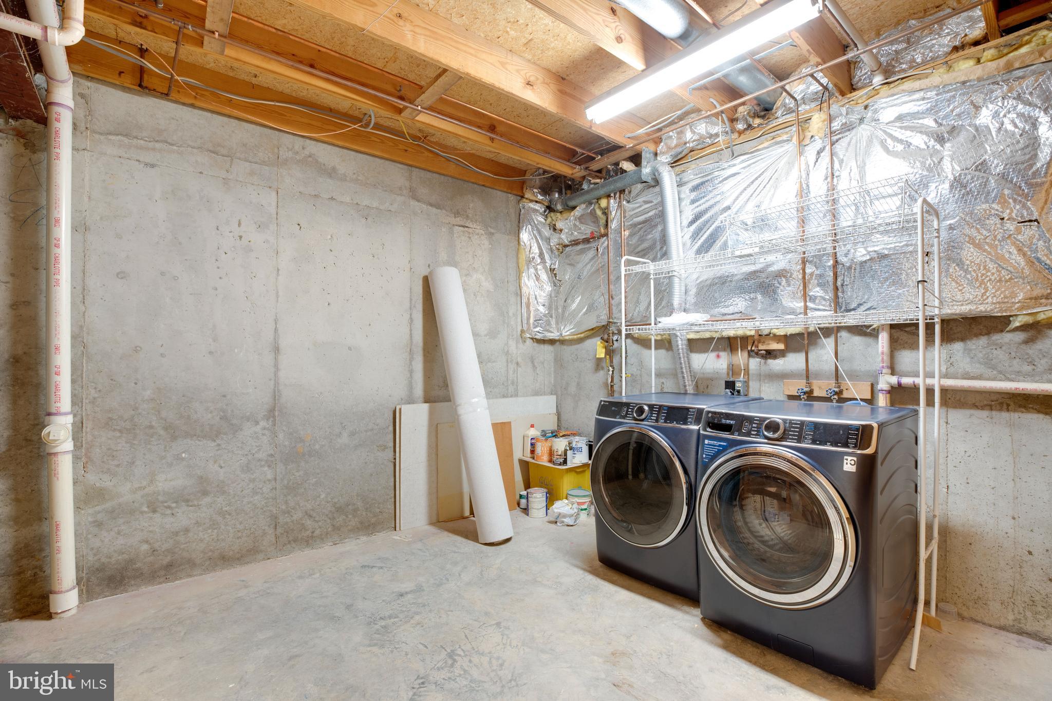 6502 Westhaven Lane Springfield, VA 22150 - Photo 28 of 31 a utility room with dryer and washer
