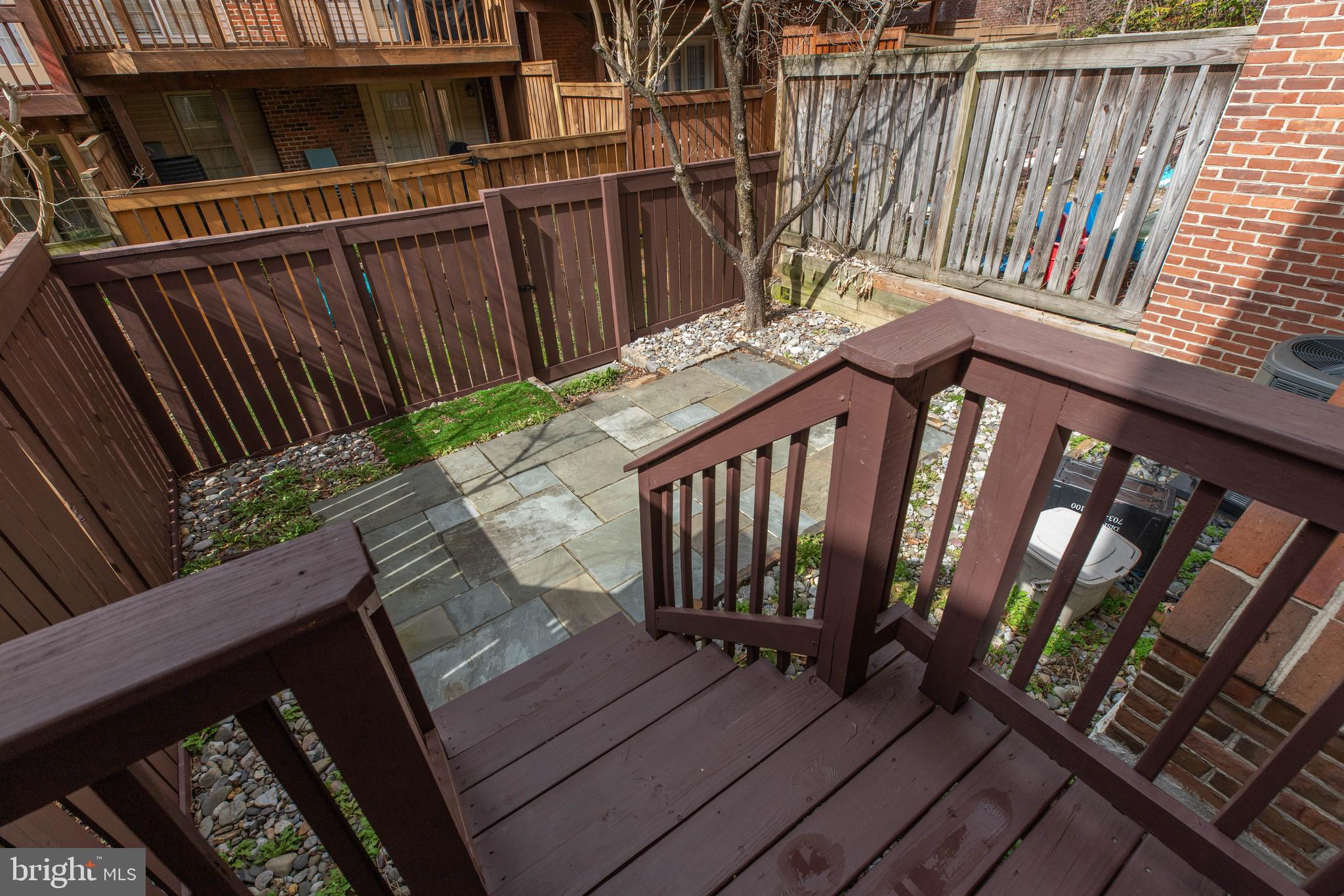 6502 Westhaven Lane Springfield, VA 22150 - Photo 30 of 31 a balcony with wooden floor stairs and a wooden bench