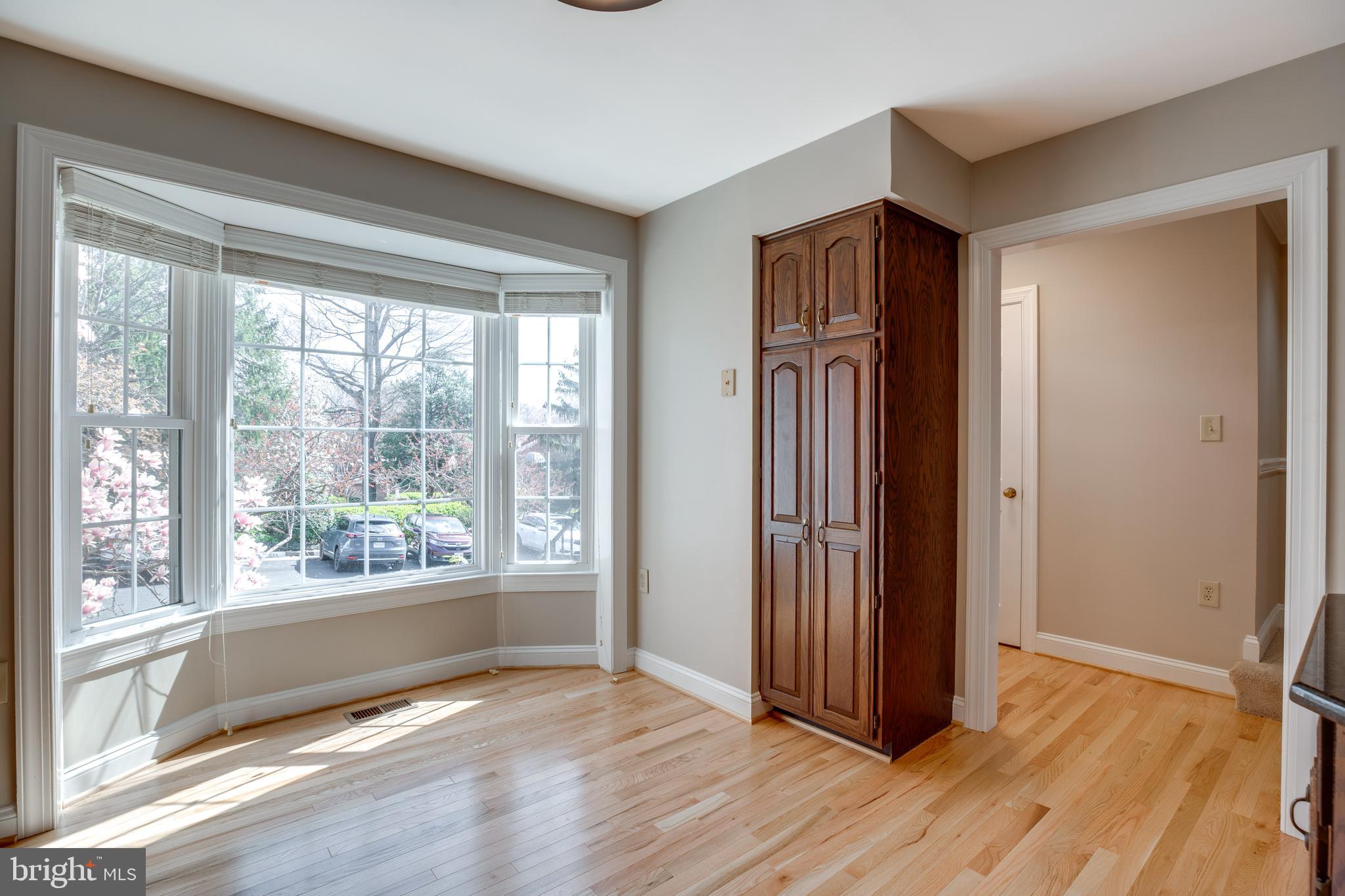 6502 Westhaven Lane Springfield, VA 22150 - Photo 6 of 31 an empty room with wooden floor and windows