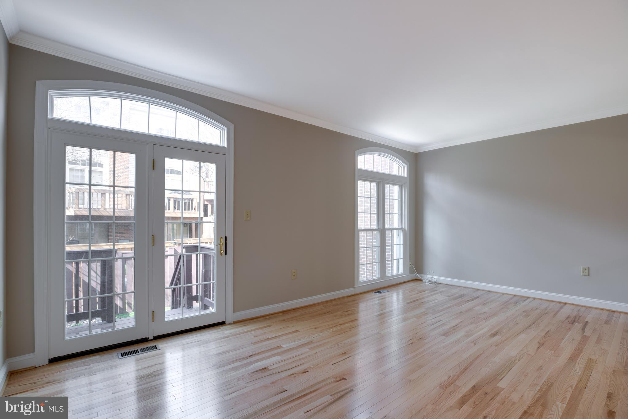 6502 Westhaven Lane Springfield, VA 22150 - Photo 9 of 31 a view of an empty room with wooden floor and a window