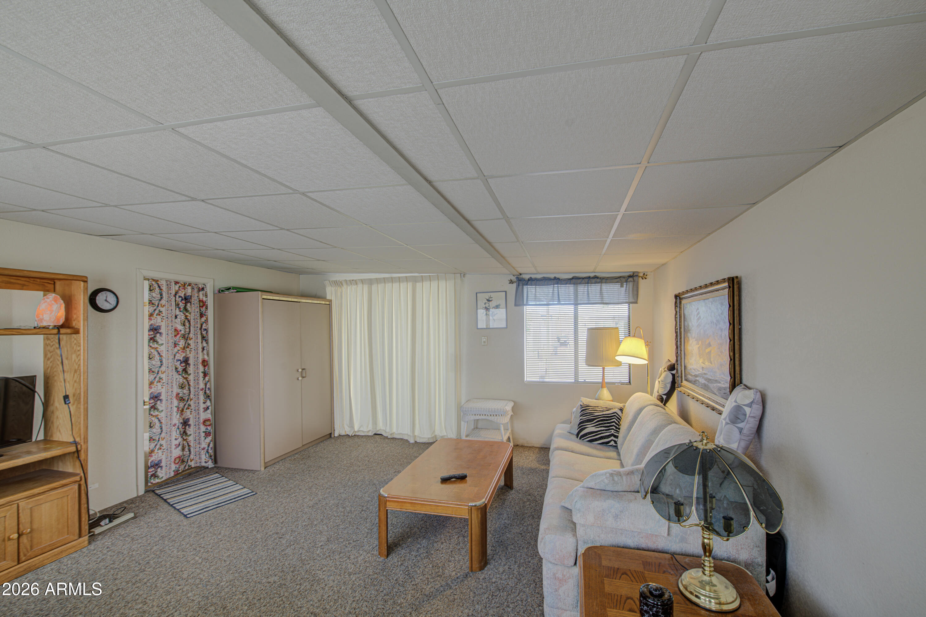 111 South Greenfield Road, Unit 747 Mesa, AZ 85206 - Photo 19 of 23 a living room with furniture and a flat screen tv