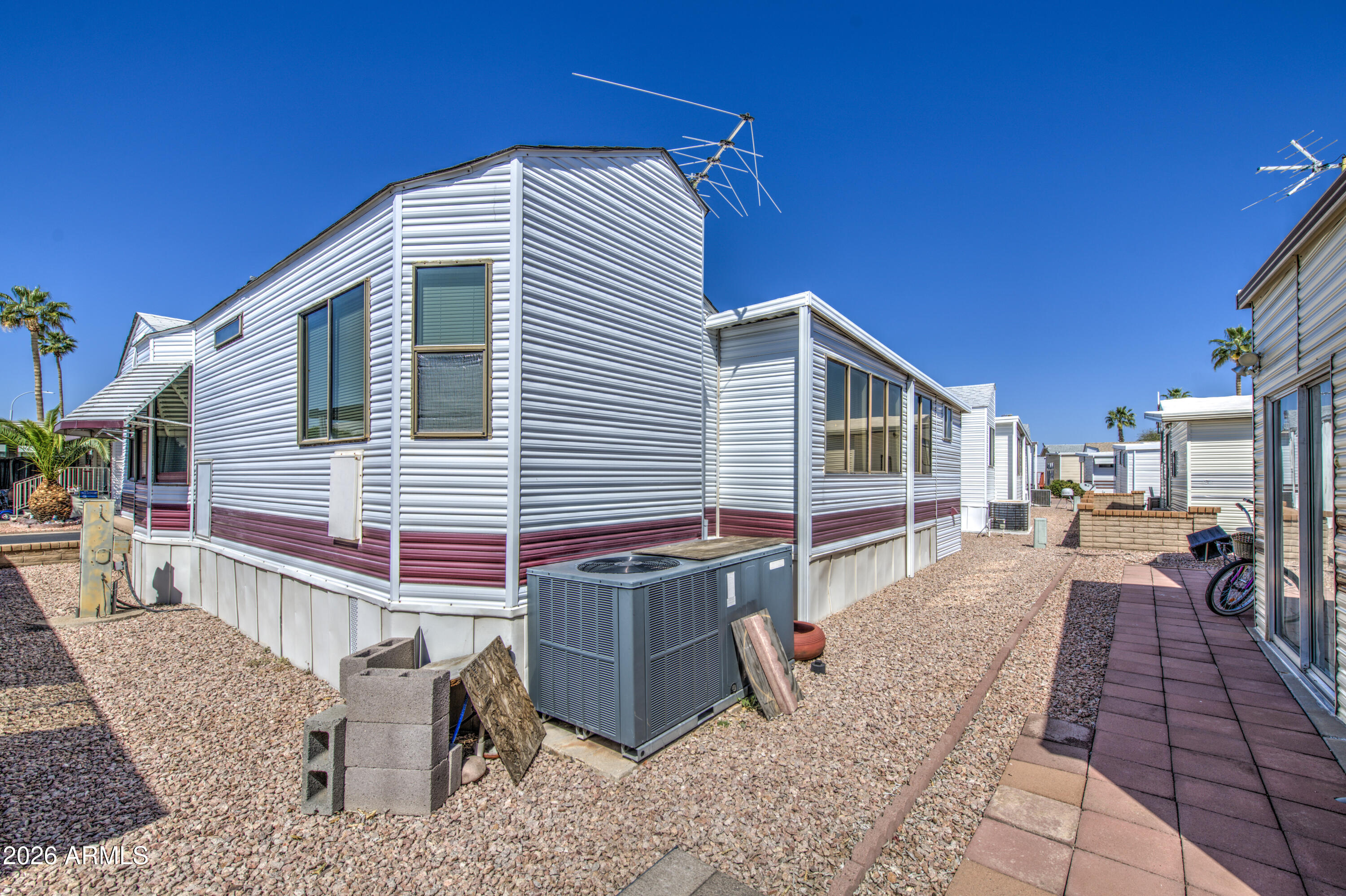 111 South Greenfield Road, Unit 747 Mesa, AZ 85206 - Photo 22 of 23 a view of a house with a patio