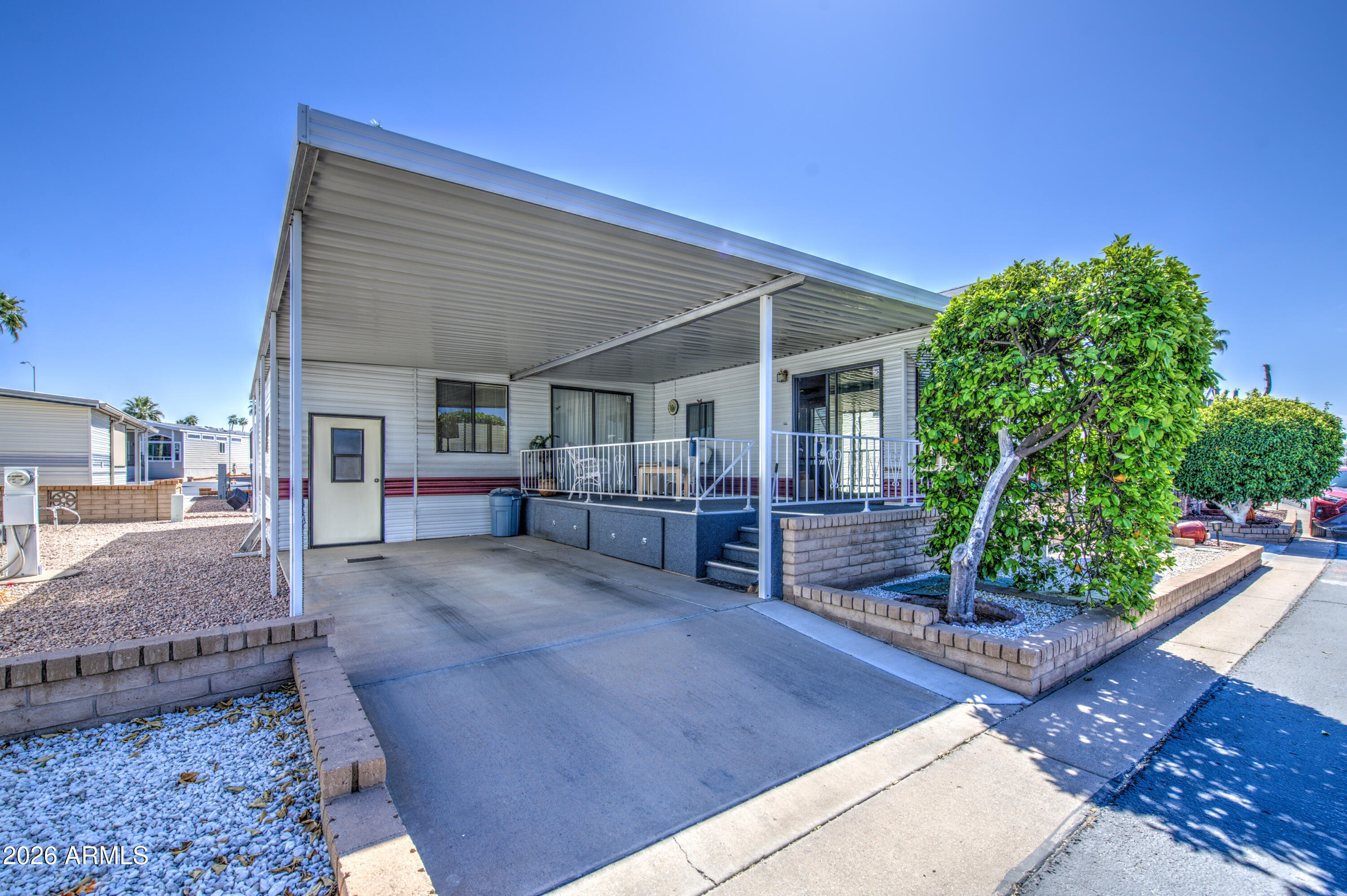 111 South Greenfield Road, Unit 747 Mesa, AZ 85206 - Photo 4 of 23 a view of an house with backyard porch and sitting area