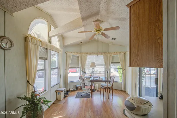 a view of a livingroom with furniture window and wooden floor