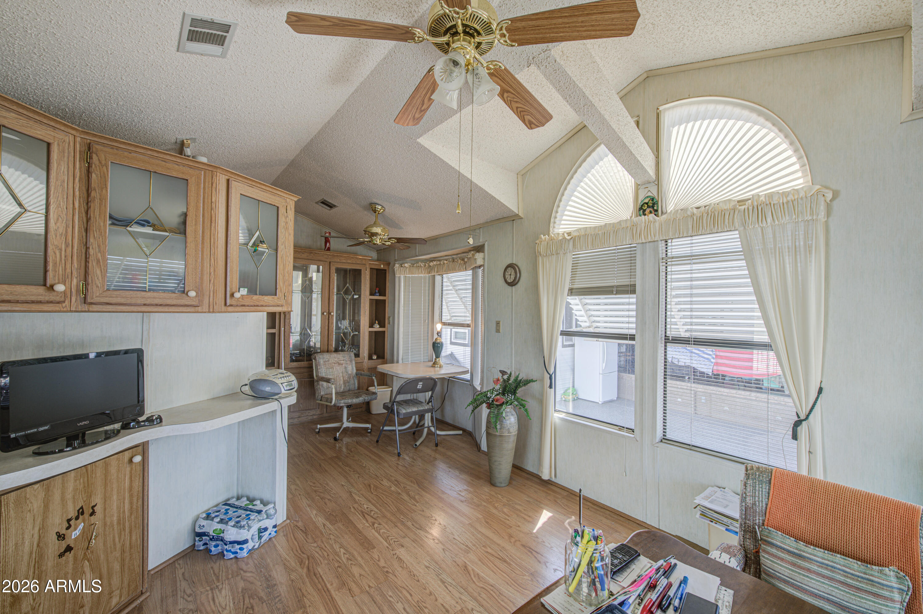 111 South Greenfield Road, Unit 747 Mesa, AZ 85206 - Photo 8 of 23 a living room with furniture and a flat screen tv