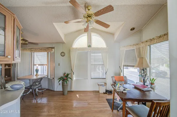a living room with furniture a window and a chandelier