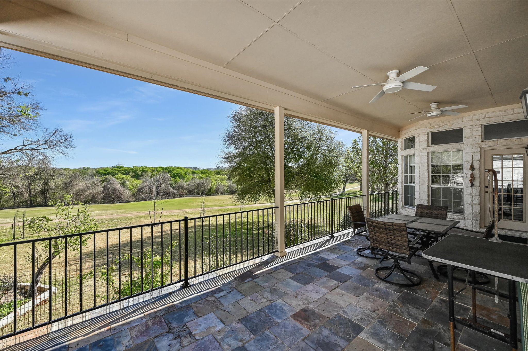 4912 Interlachen Lane Austin, TX 78747 - Photo 4 of 39 a living room with furniture and a floor to ceiling window