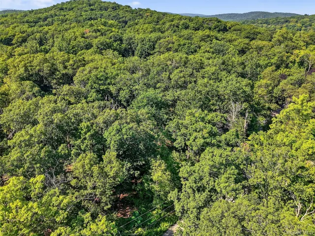 a view of a large yard with lots of green space