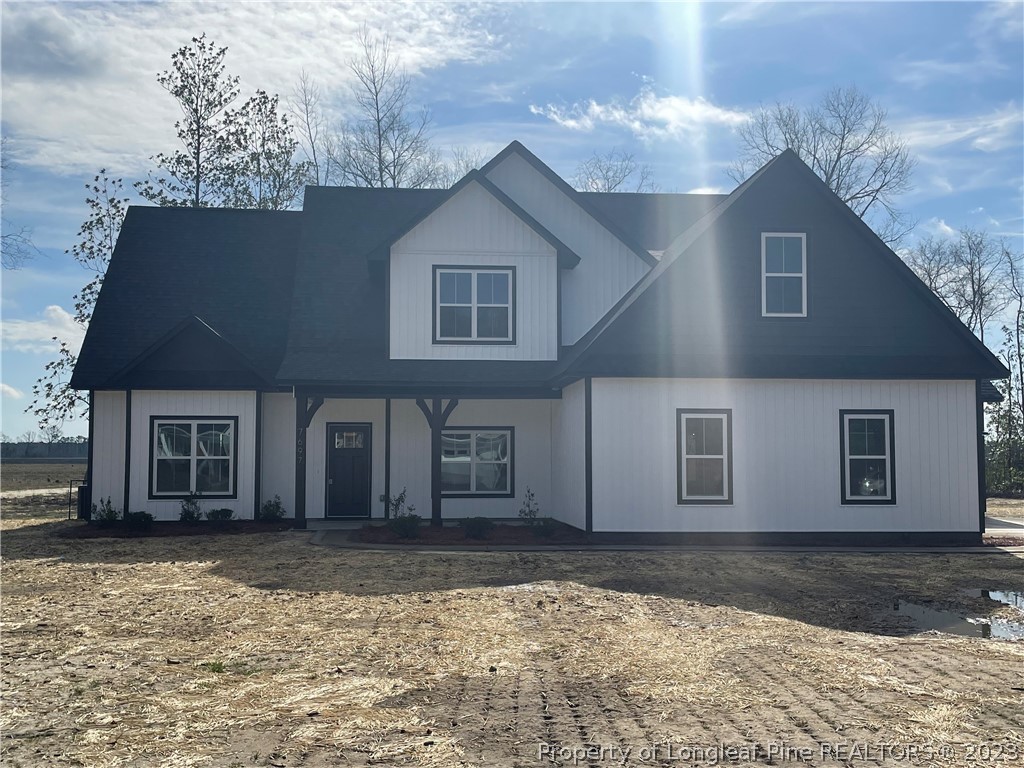 7697 Rufus Johnson Road Fayetteville, NC 28306 - Photo 1 of 16 a front view of a house with a yard