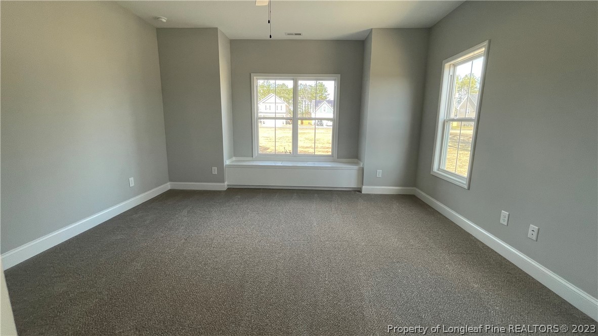 7697 Rufus Johnson Road Fayetteville, NC 28306 - Photo 10 of 16 an empty room with a window
