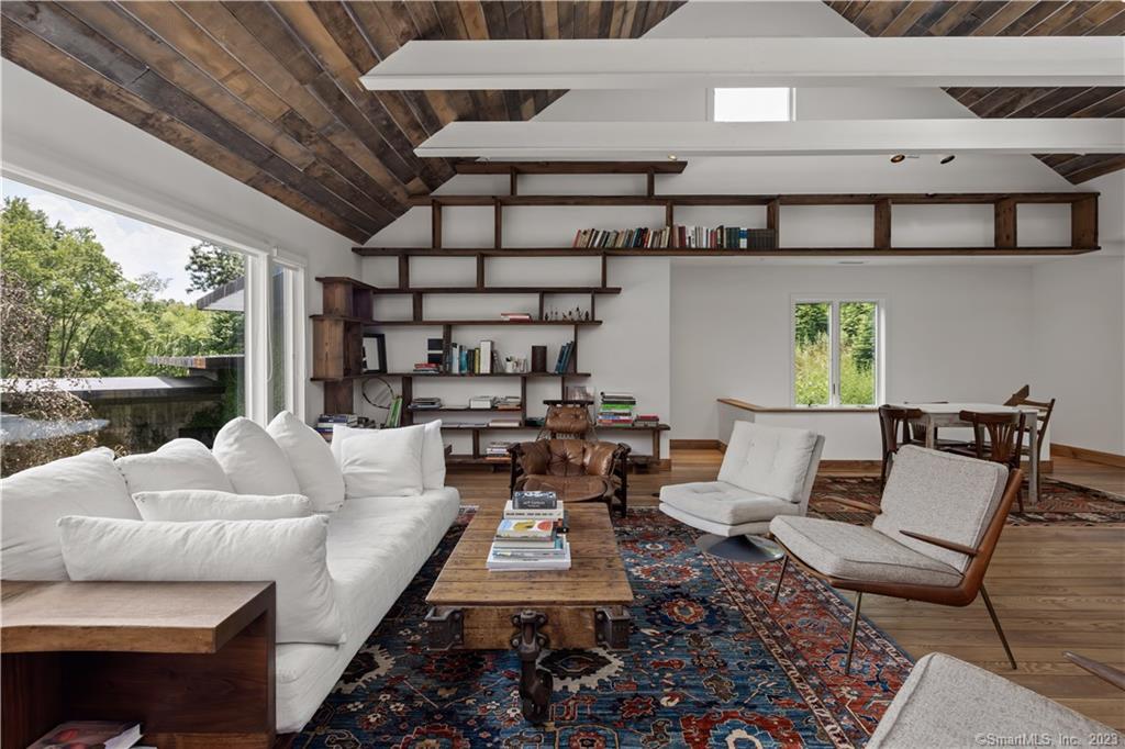 4 Good Hill Road Weston, CT 06883 - Photo 11 of 40 a living room with furniture and a floor to ceiling window