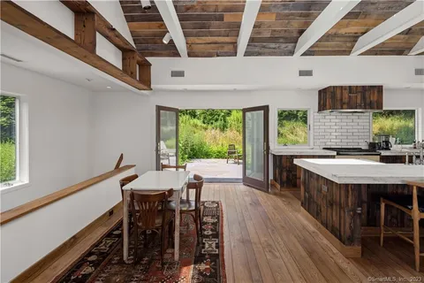 a view of backyard with seating space