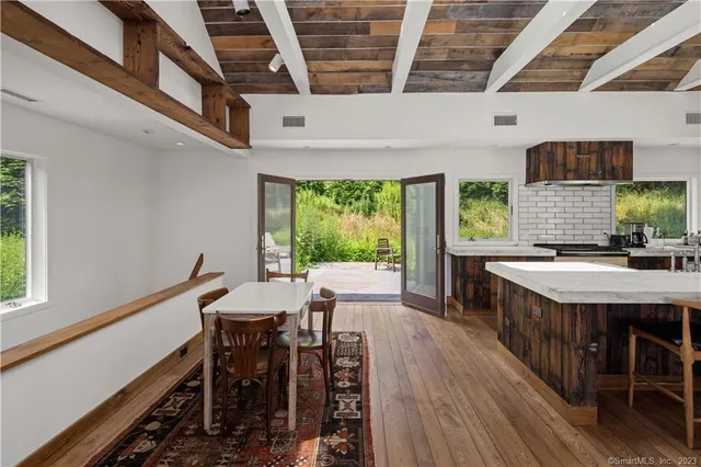 a view of backyard with seating space