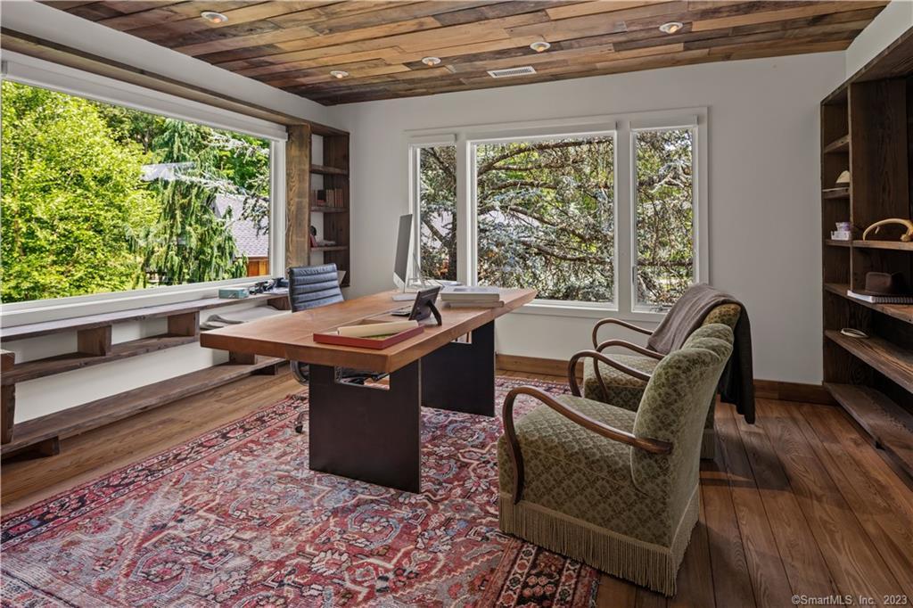 4 Good Hill Road Weston, CT 06883 - Photo 17 of 40 a room with furniture and windows