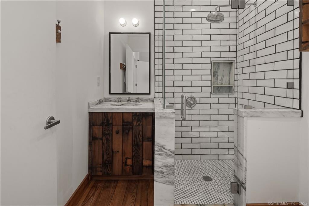 4 Good Hill Road Weston, CT 06883 - Photo 20 of 40 a bathroom with a shower and a sink