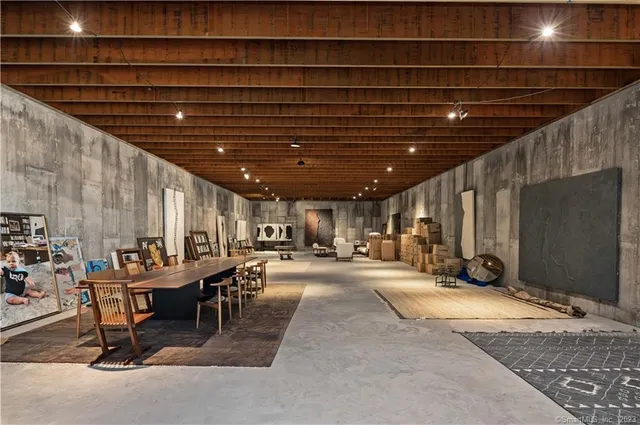 a room with gym equipment and a chandelier