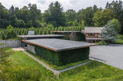 a front view of house with yard and green space