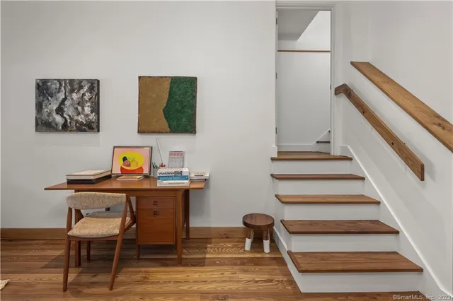 a view of a dining hall with furniture and wooden floor