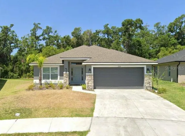 a house with trees in the background