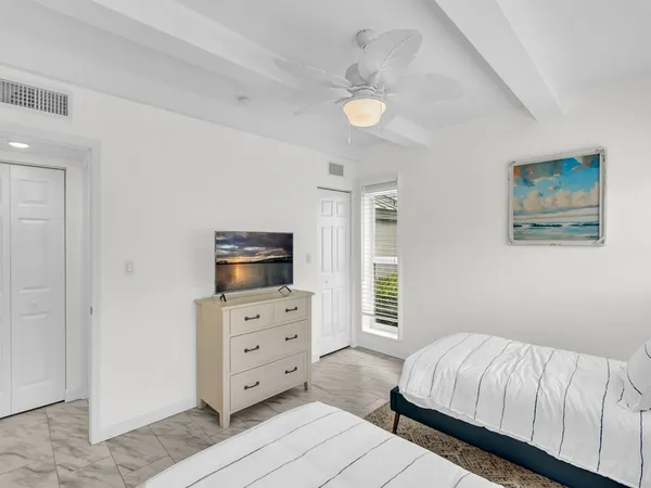 a bedroom with a bed and furniture