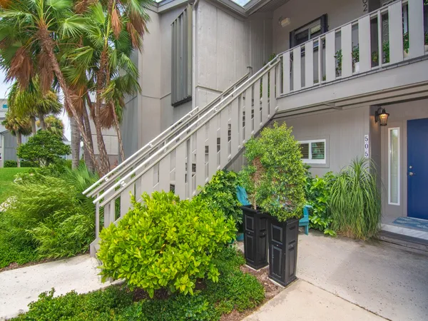 a green field with white walls