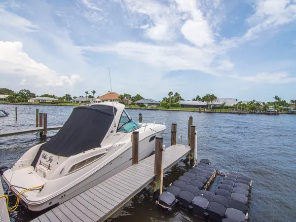 a view of a lake with houses in background